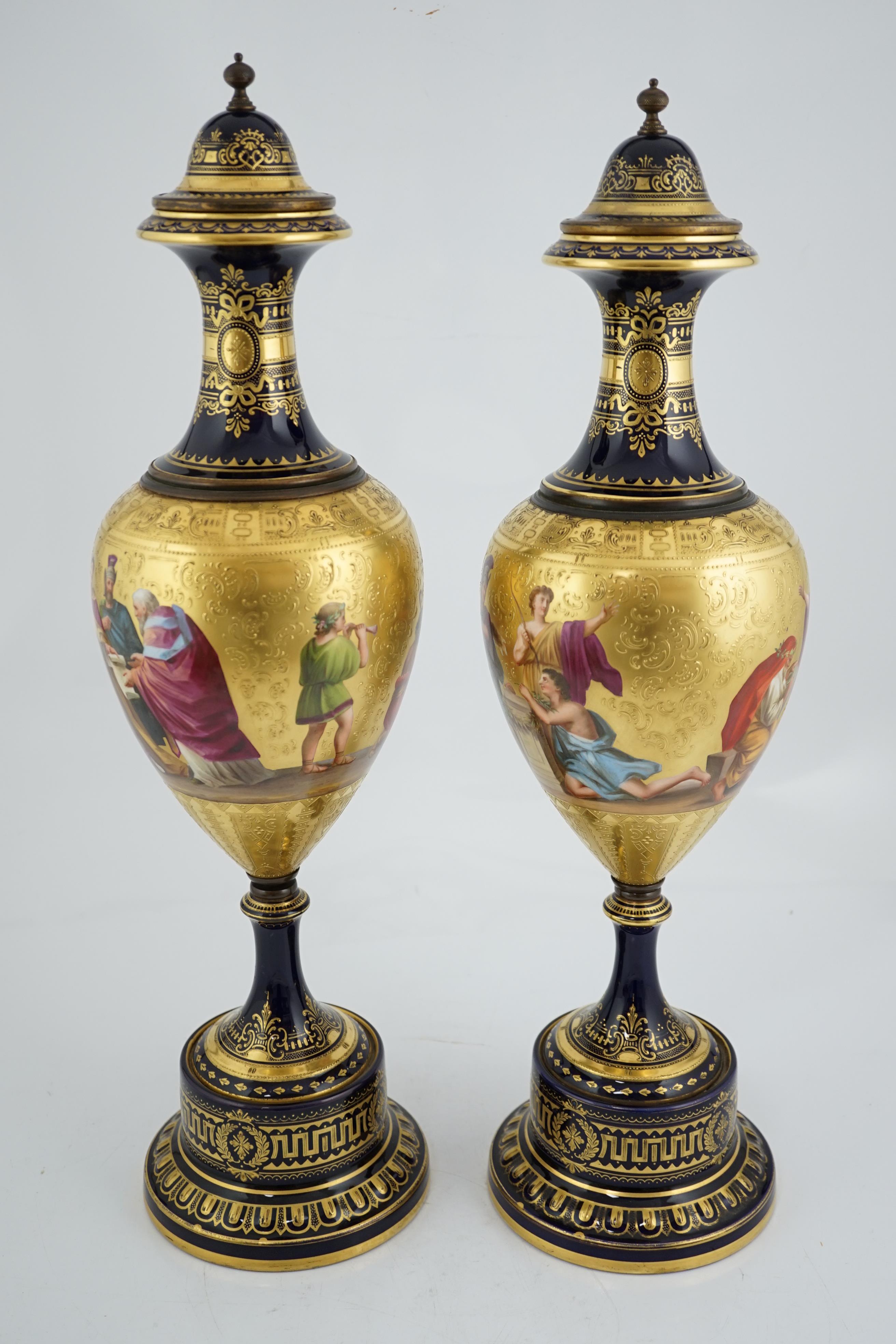 A pair of tall Vienna style porcelain vases and covers, early 20th century